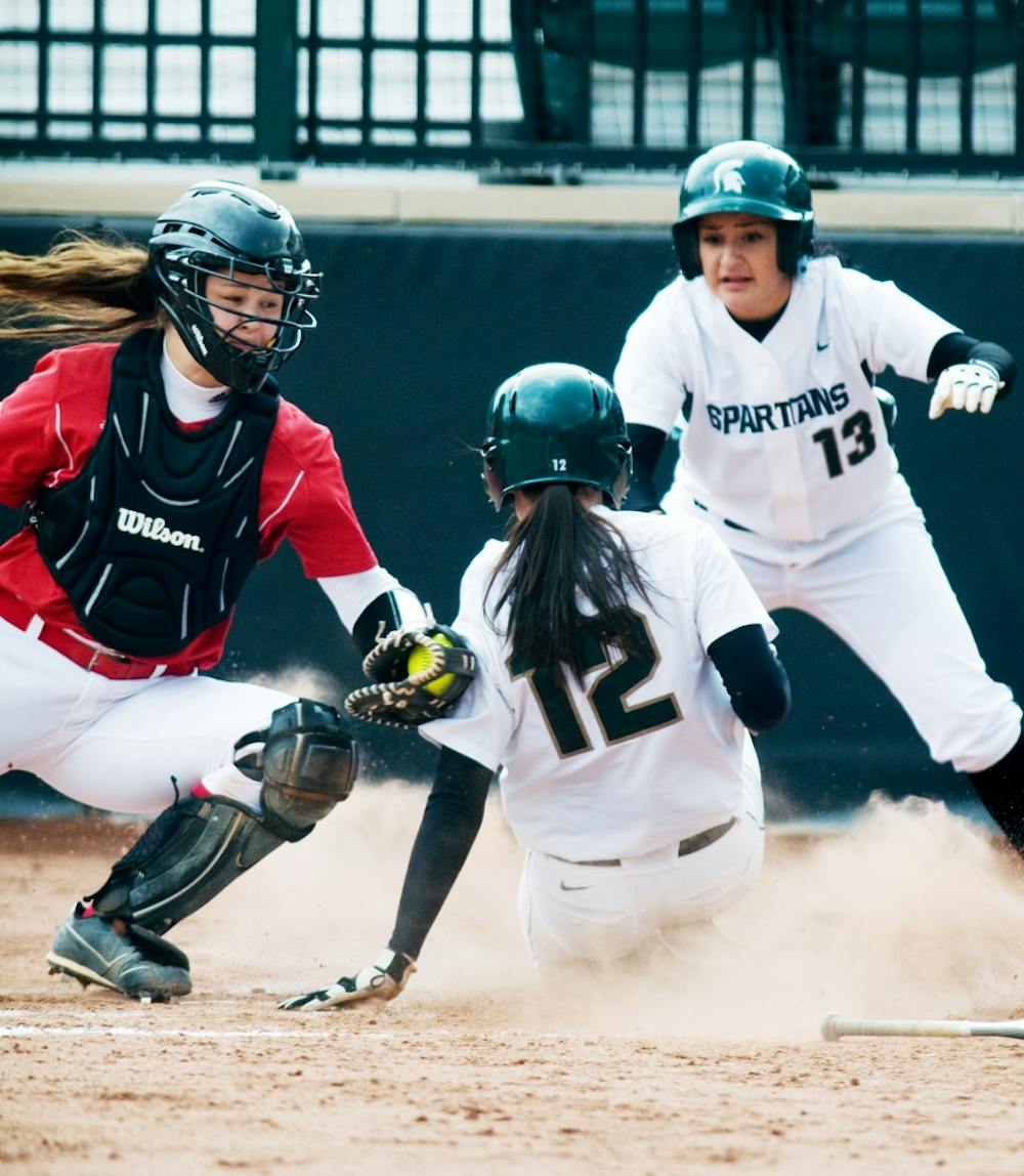 Maggie Bailey making a play at the plate as a D1 catcher at Wisconsin-Madison